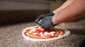 Pizza Chef Adding Mozzarella Cheese On Dough video