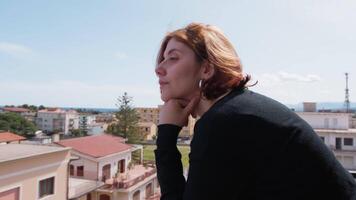 Woman Dressed In Black Looking Out From The Balcony Sees The Panorama video