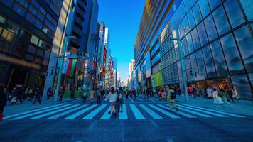 A timelapse of the city street at the downtown in Ginza Tokyo daytime wide shot tilt video