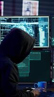 Vertical Hacker running artificial intelligence spyware software designed to gather information from users computers without their knowledge. Scammer commits fraud using AI, camera A video
