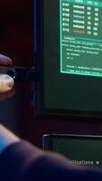 Vertical Hacker doing illegal activities in secret underground base, uploading USB flash drive containing data obtained from victim after tricking it into installing ransomware program, camera A video