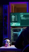 Vertical Hacker in hideout interrupted by police sirens from writing malware code on computer, running to escape before getting caught. Criminal den found by anti hacking law enforcement, camera A video