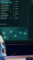 Vertical Close up of desk in criminals den and hacking software interface on PC used for stealing data and blackmailing victims. Technology in apartment used for deploying DDOS attacks scripts video