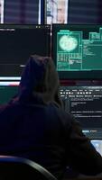 Vertical Happy man writing code on PC, celebrating after managing to get past security systems. Hacker using computer to make scripts that can hack devices, feeling proud after breaching firewall, camera A video
