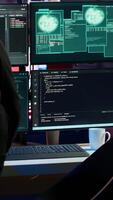 Vertical Hacker arriving in secret base with laptop, ready to start programming viruses. Scammer in criminal den opening notebook to exploit network servers and bypass security measures, camera A video