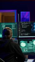 Vertical Hackers found by cybercriminal law enforcement escaping with stolen data on SSD after failing to conceal online identity. Criminal in hideout running from police after hacking into servers, camera A video