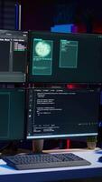 Vertical Script running on computer in secret base of operations used by hacker to steal data. Programming language on screen in empty room used by cybercriminal, attacking firewalls video
