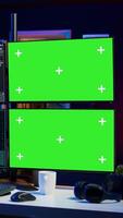 Vertical Hooded man writing lines of code on green screen PC from apartment, trying to get past security systems. Evil hacker using mockup computer to make scripts that can hack devices, camera B video