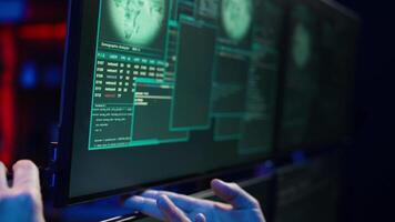 Hacker doing illegal activities in secret underground base, uploading USB flash drive containing data obtained from victim after tricking it into installing ransomware program, camera B video