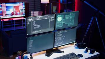 Lines of code displayed on computer monitors used by cybercriminal stealing sensitive information. Virus scripts running on PC infecting network systems, breaking passwords video