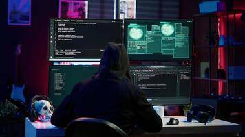Happy man writing code on PC, celebrating after managing to get past security systems. Hacker using computer to make scripts that can hack devices, feeling proud after breaching firewall, camera A video