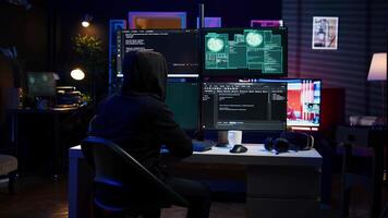 Happy man writing code on PC, celebrating after managing to get past security systems. Hacker using computer to make scripts that can hack devices, feeling proud after breaching firewall, camera B video