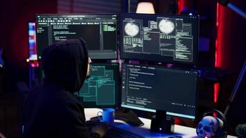 Cheerful hacker in apartment doing energic celebration after managing to steal sensitive data. Scammer happy after obtaining sensitive information from users using malware, camera B video