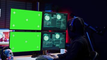 Happy man writing code on green screen PC, celebrating after managing to get past security systems. Joyous hacker feeling proud after breaching firewall using mockup computer, camera B video