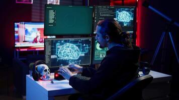 Hacker uploading script on SSD that can launch DDoS attacks on any website. Cybercriminal writing program that can crash servers, downloading it on storage drive, camera B video