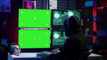 Happy man writing code on green screen PC, celebrating after managing to get past security systems. Joyous hacker feeling proud after breaching firewall using mockup computer, camera A video