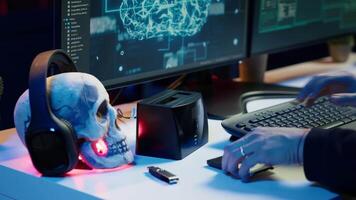 Hacker uploading script on SSD that can launch DDoS attacks on any website. Cybercriminal writing program that can crash servers, downloading it on storage drive, camera A video