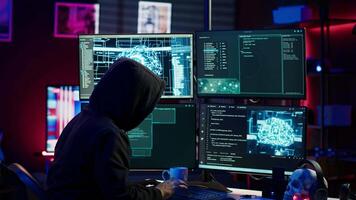Hacker running artificial intelligence spyware software designed to gather information from users computers without their knowledge. Scammer commits fraud using AI, camera A video
