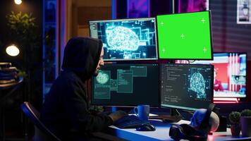 Hacker using green screen PC and AI to find unpatched connections and steal data. Scammer using artificial intelligence and chroma key computer to compromise digital devices, camera A video