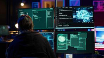 Hacker drinking coffee while running artificial intelligence spyware software designed to gather information from users. Script kiddie doing illegal stuff using AI, consuming beverage, camera A video