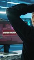 Vertical Admin in server hub panicked by valuable data threatened by hacking attack on computers. Scared coworkers failing to safeguarding data center against unauthorized access and vulnerabilities video