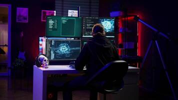 Hacker in hideout interrupted by police sirens from writing malware code on computer, running to escape before getting caught. Criminal den found by anti hacking law enforcement, camera B video