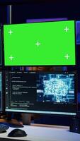 Vertical Cybercriminal using AI machine learning and isolated screen PC to develop system exploits. Hacker using artificial intelligence tech and mockup monitor to build script tricking firewalls, camera B video