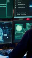 Vertical Rogue computer scientist uses AI machine learning to develop zero day exploit undetectable by antivirus. Hacker uses artificial intelligence neural networks to build script tricking firewall, camera A video