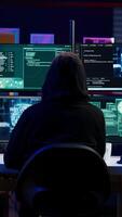 Vertical Cybercriminal using AI machine learning to develop zero day exploit undetectable by antivirus software. Hacker using artificial intelligence technology to build script tricking firewalls, camera B video