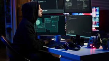 Cheerful hacker in apartment doing energic celebration after managing to steal sensitive data. Scammer happy after obtaining sensitive information from users using malware, camera A video