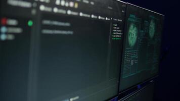 Desk with decorations in empty criminals den and hacking software interface on PC screens. Equipment in apartment used for deploying malware programming script on displays in underground base video