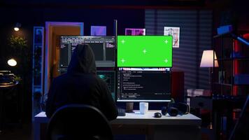 Cybercriminal uploading USB flash drive containing stolen information into green screen computer. Scammer inserting storage device into chroma key PC with data obtained from security breach, camera B video