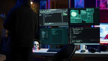 Hacker arriving in hidden underground shelter, prepared to launch DDoS attack on websites. Cybercriminal in apartment starting work on script that can crash businesses servers, camera A video