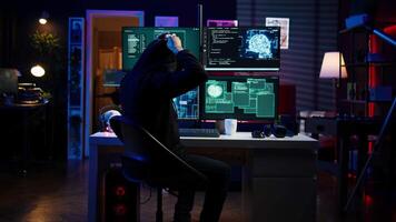 Hacker using virtual reality headset to code malware exploiting network backdoors, bypassing security measures such as logins and password protections using futuristic VR goggles tech, camera B video