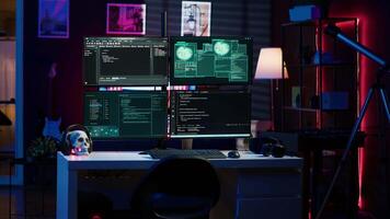 Script running on computer in secret base of operations used by hacker to steal data. Programming language on screen in empty room used by cybercriminal, attacking firewalls video