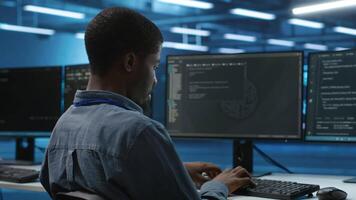 IT specialist in server farm ensuring valuable data remains shielded from potential threats, safeguarding against unauthorized access and vulnerabilities, securing system from virus attacks video