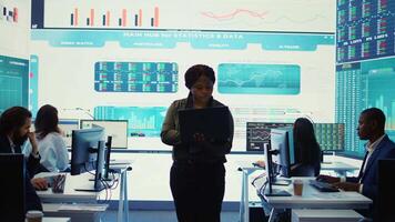 Business analyst looking into statistics and reports to detect any obstacles within the project structure, preparing solutions to ensure productivity. Manager studies numbers. Camera B. video