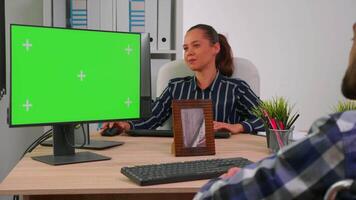 Paralysed disabled freelancer looking at pc with green screen talking with colleagues. Immobilized businessman in wheelchair using computer with chroma key, mockup, greenscreen for videomeeting. video