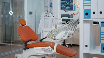 Revealing shot of empty medical stomatology orthodontic hospital office with nobody in it. Professional dental teeth dril and other healthcare instruments prepared for tooth diagnosis video