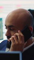 Vertical Chief executive officer presenting performance metrics numbers to shareholder on phone call, provide statistics about organizational progress to obtain more funds and increase budget. Camera A. video