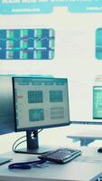 Vertical Multinational company headquarters office with a big data screen, technology used for employees to monitor numbers and infographics relevant to business development or expansion. Camera B video
