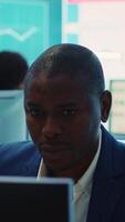 Vertical Financial manager implementing new ideas to increase business profit, evaluating market trends to create a strategy for global expansion. Accounting specialist explores possibilities. Camera A. video