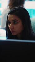 Vertical Indian office administrator explores partnership opportunities for the global business expansion plans, establishing current enterprise objectives. Analyst doing a win or loss study. Camera A. video