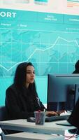 Vertical Financial manager briefing his team members about new corporation objectives, presenting their budget scheme with expenses. Resource allocation and project planning in control room. Camera A. video