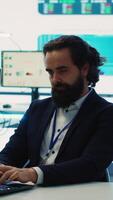 Vertical Chairman of the advisory board transmits potential company expansion plans, supervisor and the staff look into data visualizations on a big screen. Teamwork to boost affordable earnings. Camera A video
