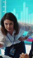 Vertical Irritated angry team leader screaming at her coworker after he failed to calculate expenditures, showing her disappointment in front of everyone. Furious dissatisfied business manager. Camera A. video