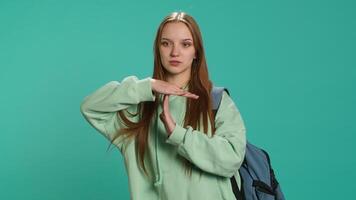 Portrait of assertive woman asking for timeout, doing hand gestures, feeling fatigued. Unhappy girl doing vehement pause sign gesturing, wishing for break, studio background, camera A video
