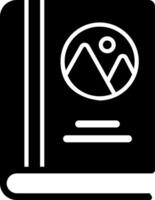 A black and white icon of a book with a mountain in the background vector