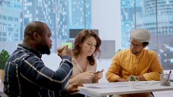 Entrepreneur meeting with a real estate broker on an office tour, guiding the client around the high class workspace and presenting architectural plans and blueprints. Business investment. Camera A. video