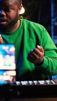 Vertical Musician doing online paid classes to help people play piano notes, teaching lessons from his home studio and recording tutorials. Musical instructor playing midi controller keyboard. Camera A. video